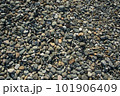 Different color beach stone pebbles at seashore outdoors top view. Abstract smooth round pebbles sea 101906409