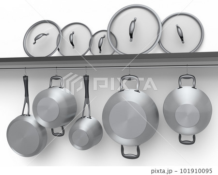 Set of stewpot, frying pan and chrome plated cookware hanging on shelf on white 101910095