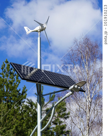 A pole with a innovative LED street light powered by solar cells panel and small wind turbine A pole with a innovative LED street light powered by solar cells panel and small wind turbine 101910213
