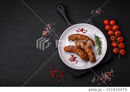 Delicious fried grilled sausages with salt, spices and herbs Delicious fried grilled sausages with salt, spices and herbs 101910479