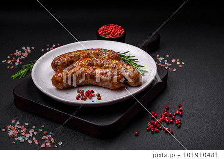 Delicious fried grilled sausages with salt, spices and herbs 101910481