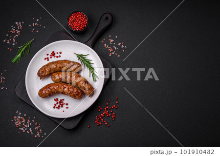 Delicious fried grilled sausages with salt, spices and herbs Delicious fried grilled sausages with salt, spices and herbs 101910482