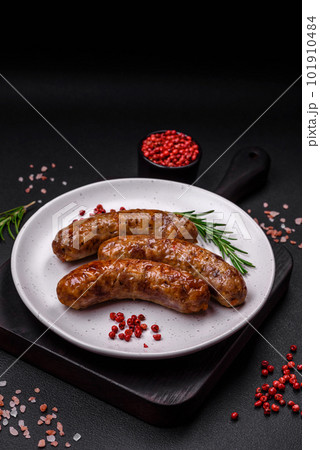 Delicious fried grilled sausages with salt, spices and herbs Delicious fried grilled sausages with salt, spices and herbs 101910484