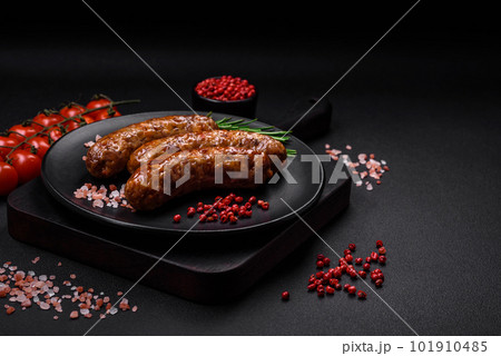 Delicious fried grilled sausages with salt, spices and herbs 101910485