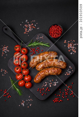 Delicious fried grilled sausages with salt, spices and herbs Delicious fried grilled sausages with salt, spices and herbs 101910509