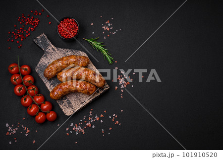 Delicious fried grilled sausages with salt, spices and herbs 101910520