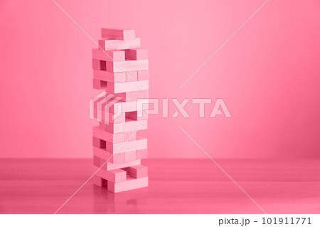 Trendy color of the year 2023 - Viva Magenta. Tower of wood blocks. Trendy color of the year 2023 - Viva Magenta. Tower of wood blocks. 101911771
