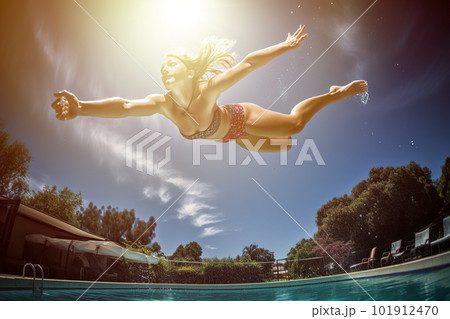Capture the excitement of diving into a pool on a hot day. The focus of the image would be on a model mid-dive, wearing a sleek and sporty swimsuit. Generative AI 101912470
