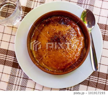 Custard dessert Catalan cream from milk and eggs with sugar crust 101917293