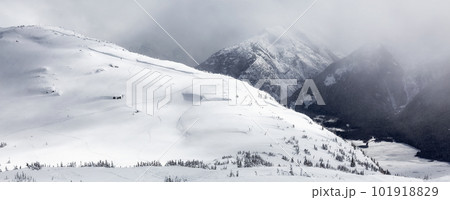 Snow Covered Mountain Peak during snowy winter day. Snow Covered Mountain Peak during snowy winter day. 101918829