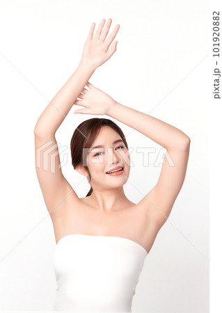 Beautiful Young Asian woman lifting hands up to show off clean and hygienic armpits or underarms on white background, Smooth armpit cleanliness and protection concept Beautiful Young Asian woman lifting hands up to show off clean and hygienic armpits or underarms on white background, Smooth armpit cleanliness and protection concept 101920882