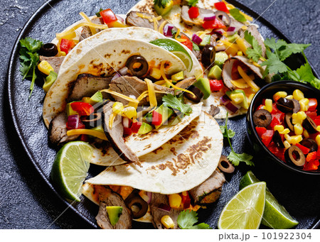 Beef Steak Tacos with veggies, avocado, corn 101922304