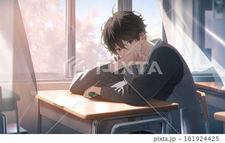 教室の机に座る男子学生 101924425