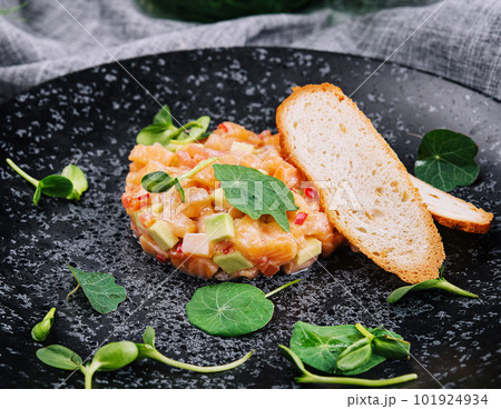Delicious avocado and raw salmon salad 101924934