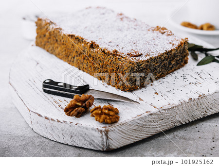 Juicy poppy seed cake with tea cup Juicy poppy seed cake with tea cup 101925162