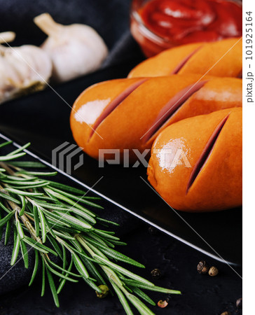 Fried sausages with potatoes and ketchup Fried sausages with potatoes and ketchup 101925164