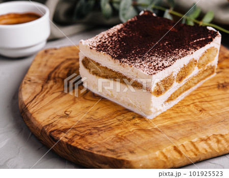 Traditional italian tiramisu dessert with cup of coffee Traditional italian tiramisu dessert with cup of coffee 101925523