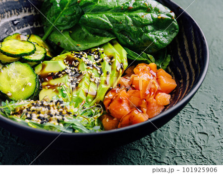 poke bowl with salmon, avocado and cucumber 101925906