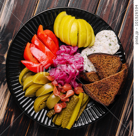 Delicious spicy pickles cut on a serving plate 101926594