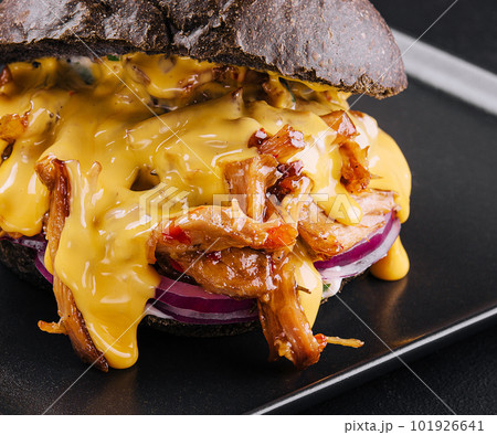 black burger with pulled pork on black 101926641