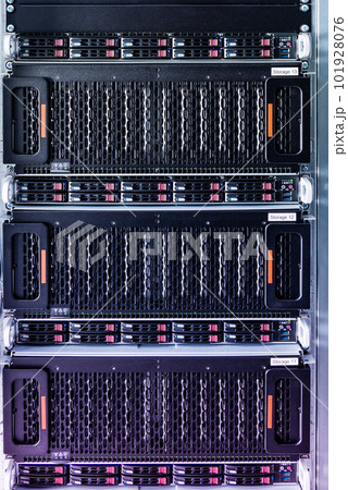 Row of hard drives serving as data storage inside server room 101928076