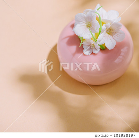 Pink mousse cakes decorated with white flowers Pink mousse cakes decorated with white flowers 101928197