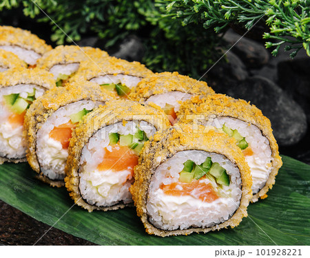 Sushi rolls tempura with salmon on plate. Japanese food style. Sushi rolls tempura with salmon on plate. Japanese food style. 101928221