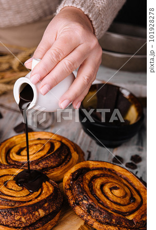 sweet chocolate cinnamon rolls on wood sweet chocolate cinnamon rolls on wood 101928278