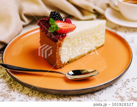 Piece of cheesecake and coffee cup 101928327