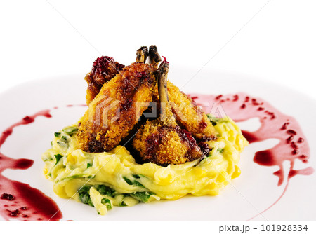 breaded duck with mashed potatoes on plate breaded duck with mashed potatoes on plate 101928334