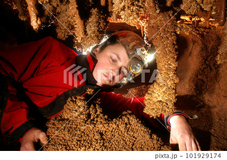 Spelunker admiring the stalacties 101929174
