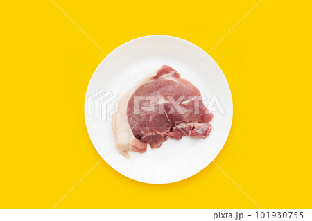 Pork meat on yellow background. Pork meat on yellow background. 101930755