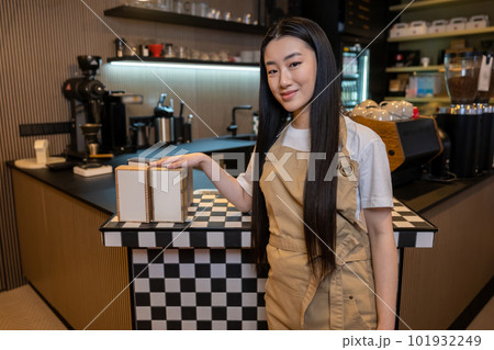 Cafe employee posing for the camera in the working place 101932249