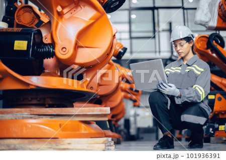 Smart engineer working woman working machine inspector with laptop computer in assembly plant Smart engineer working woman working machine inspector with laptop computer in assembly plant 101936391