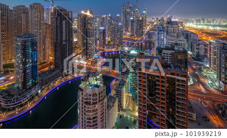 View of various skyscrapers in tallest recidential block in Dubai Marina aerial day to night timelapse 101939219