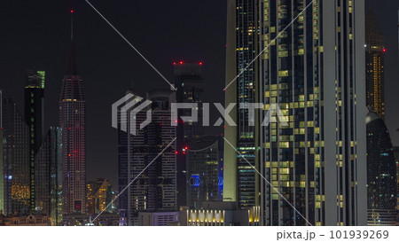 Row of the tall buildings around Sheikh Zayed Road and DIFC district aerial all night timelapse in Dubai 101939269