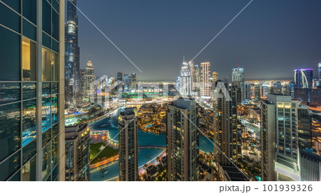 Dubai downtown with fountains and modern futuristic architecture aerial day to night timelapse 101939326