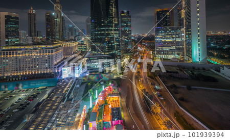 Panorama showing Dubai International Financial district aerial night timelapse. View of business and financial office towers. 101939394
