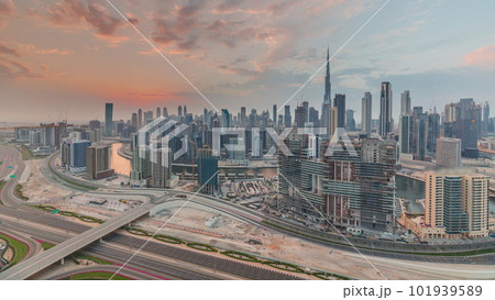 Skyline with modern architecture of Dubai business bay towers at sunset timelapse. Aerial view Skyline with modern architecture of Dubai business bay towers at sunset timelapse. Aerial view 101939589