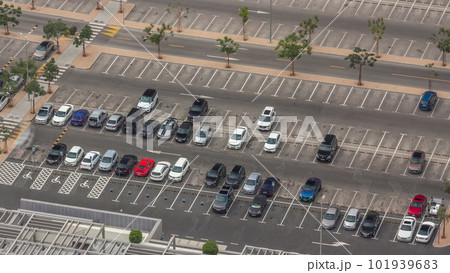 Big parking lot near mall crowded by many cars timelapse aerial view 101939683