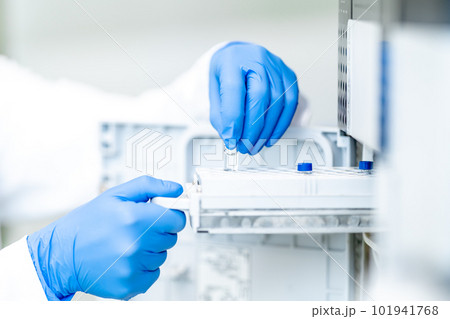 examination of a chemical sample using modern devices in the biochemical laboratory of the research institute examination of a chemical sample using modern devices in the biochemical laboratory of the research institute 101941768
