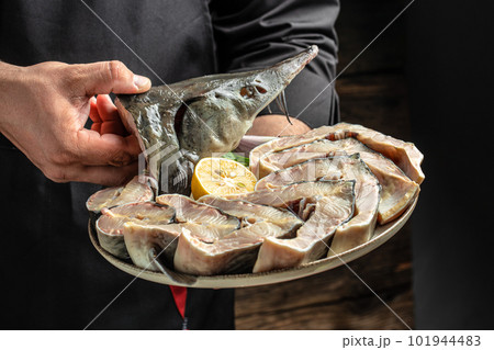 steaks of large raw sturgeon. Culinary, cooking, bakery concept. banner, menu, recipe place for text, top view steaks of large raw sturgeon. Culinary, cooking, bakery concept. banner, menu, recipe place for text, top view 101944483