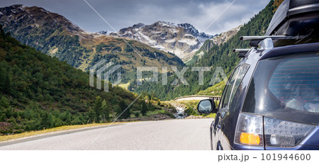 car for traveling with a mountain road 101944600