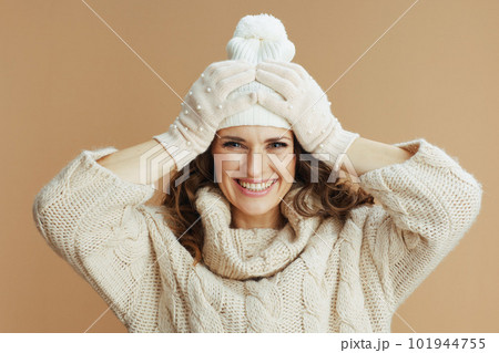 smiling elegant woman isolated on beige background smiling elegant woman isolated on beige background 101944755