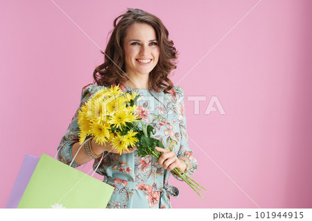 happy trendy 40 years old woman in floral dress on pink happy trendy 40 years old woman in floral dress on pink 101944915