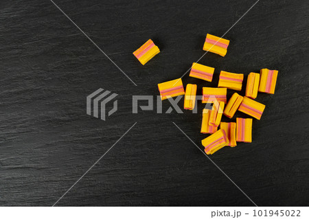 Chewing Gum Cubes Pile on Black Plate, Fruit Color Bubble Gum Collection Chewing Gum Cubes Pile on Black Plate, Fruit Color Bubble Gum Collection 101945022