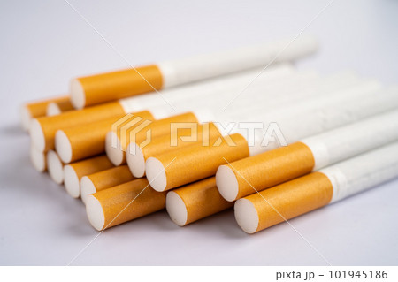 Cigarette, tobacco in roll paper with filter tube, No smoking concept. Cigarette, tobacco in roll paper with filter tube, No smoking concept. 101945186