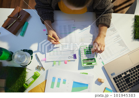 accountant woman with calculator and documents working accountant woman with calculator and documents working 101945383