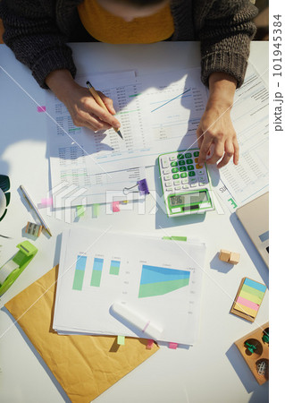 accountant woman with calculator and documents working accountant woman with calculator and documents working 101945384