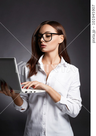 beautiful Business woman in glasses. pretty girl with laptop 101945907